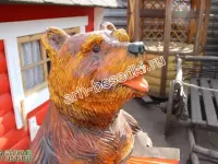 Деревянная скульптура "Медведь с гармошкой"